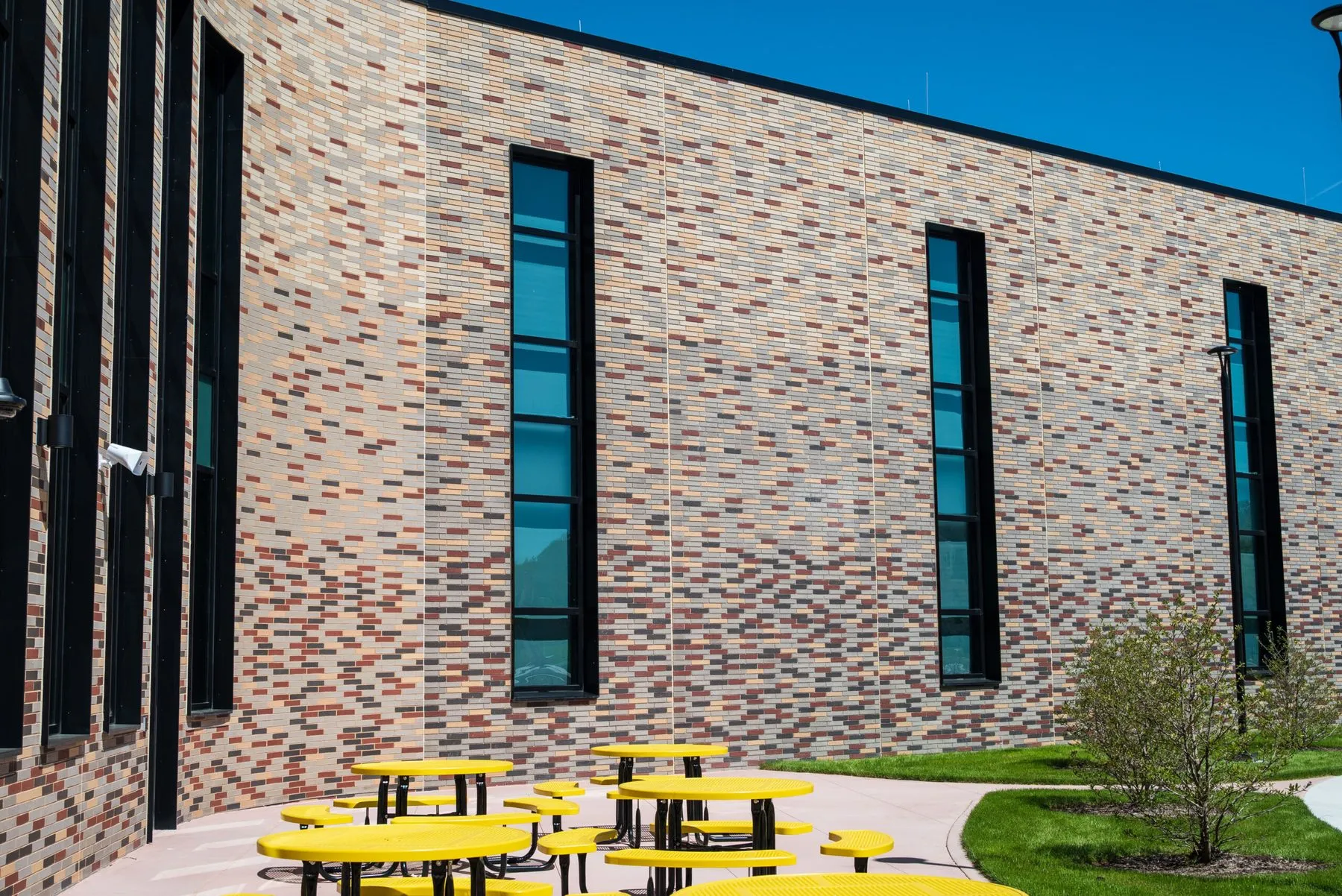 Elevation of the school showing the brick blend running the full height of the wall with narrow vertical windows