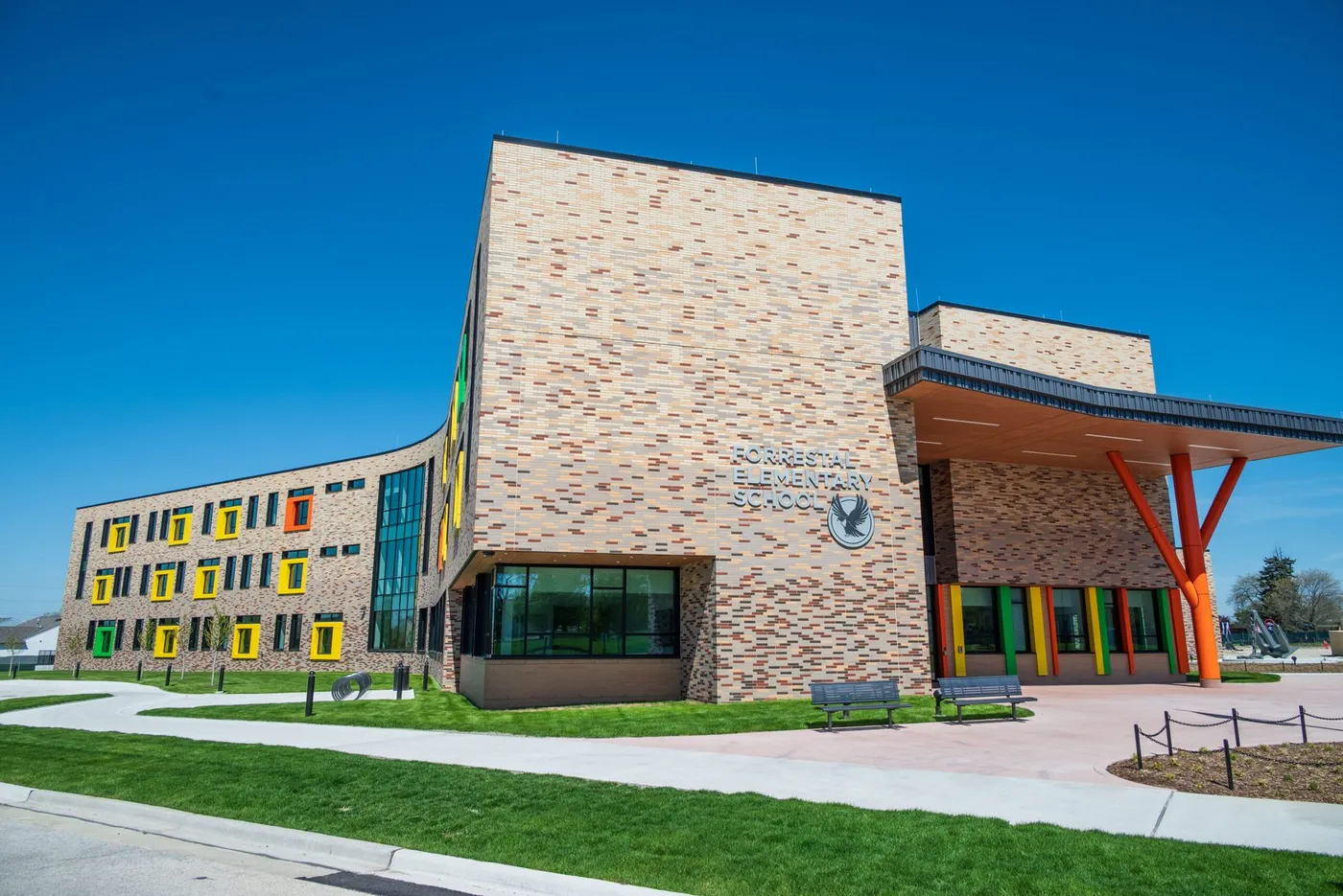 Forrestal Elementary School at Naval Station Great Lakes, a three-story brick building with a graduated brick blend and brightly colored window surrounds