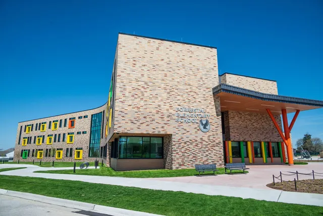 Forrestal Elementary School at Naval Station Great Lakes, a three-story brick building with a graduated brick blend and brightly colored window surrounds