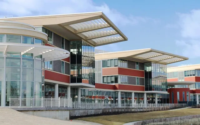 Two patient pavilions at Northwestern Medicine Catherine Gratz Griffin Lake Forest Hospital, with deep precast roof overhangs and red brick-faced precast panels