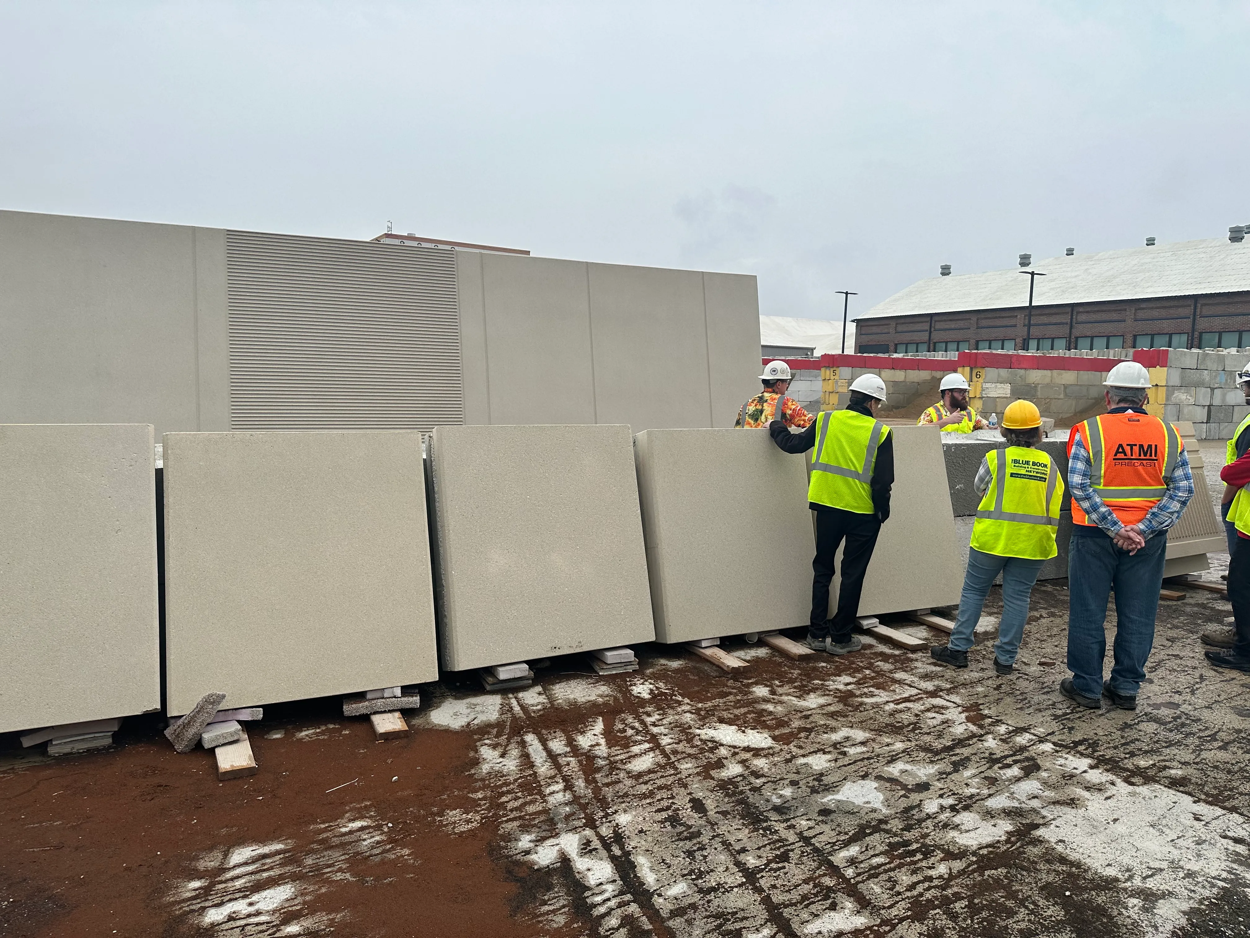 Concrete being placed into a precast form on the production floor at a PCI-certified plant
